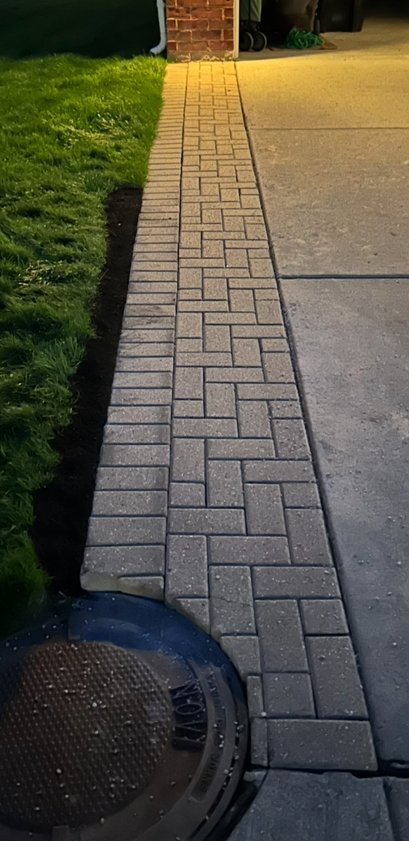 Pavers realigned and locked into a tight, clean pattern
