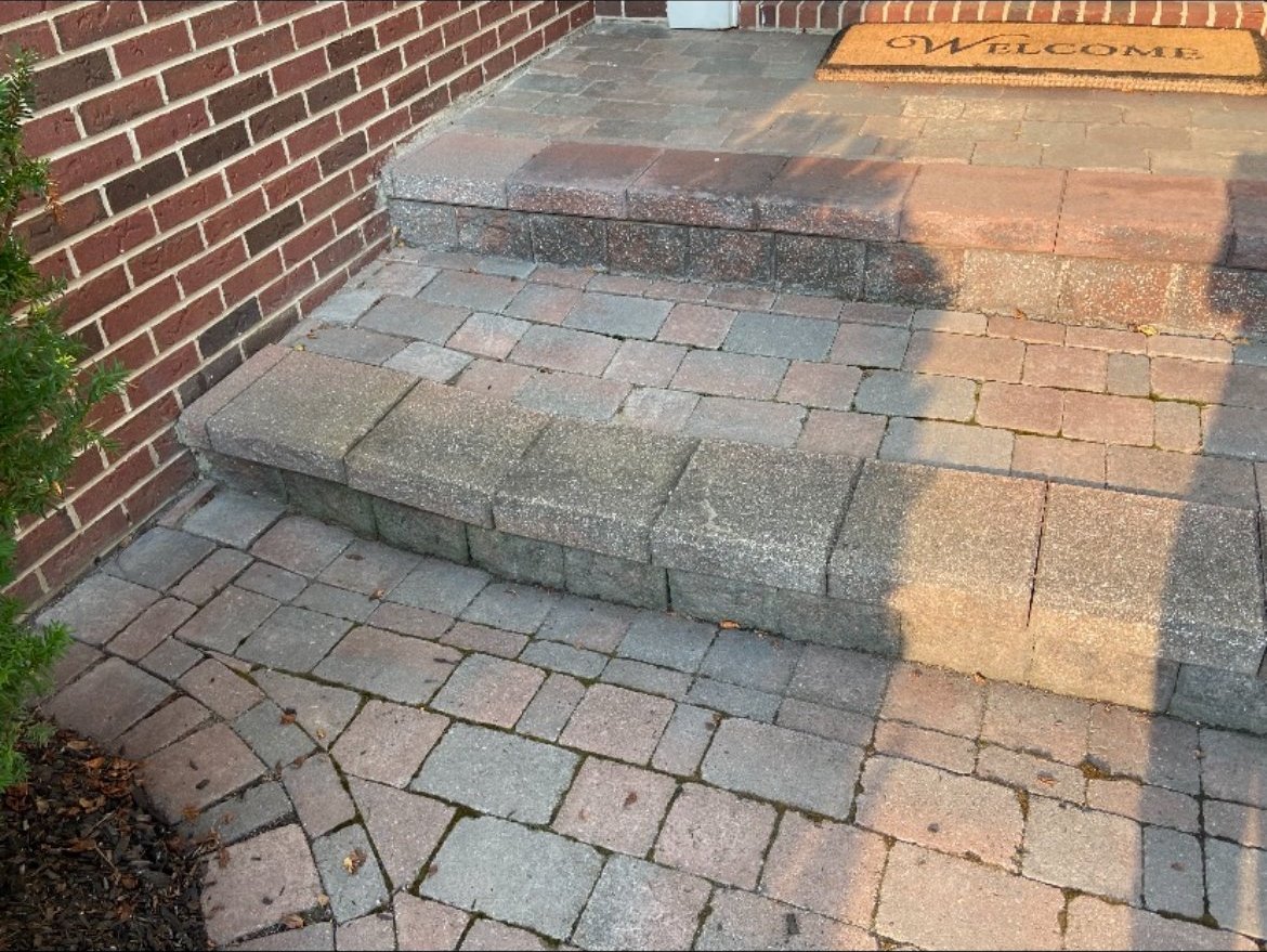 Settled, uneven patio steps in need of restoration